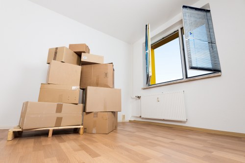 Professional movers handling furniture during small removals in Ealing