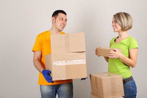Professional movers handling office equipment during an Ealing relocation