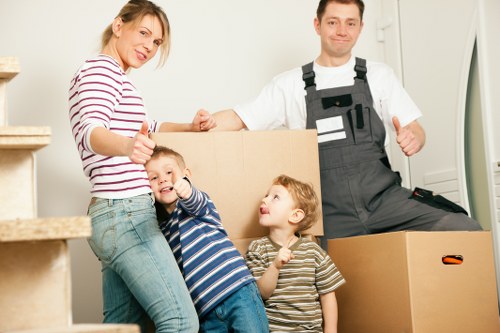 Professional movers loading furniture during house removals in Ealing